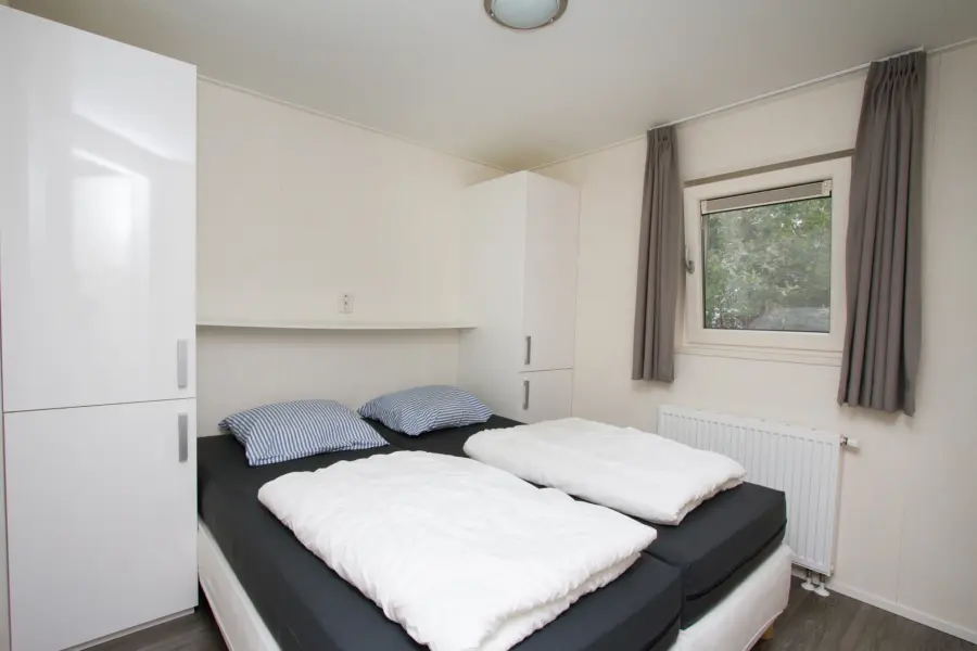 Ouderslaapkamer bos chalet kleiner