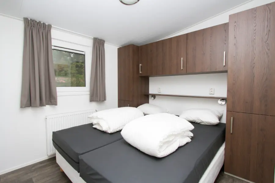 Ouderslaapkamer chalet met overdekt terras