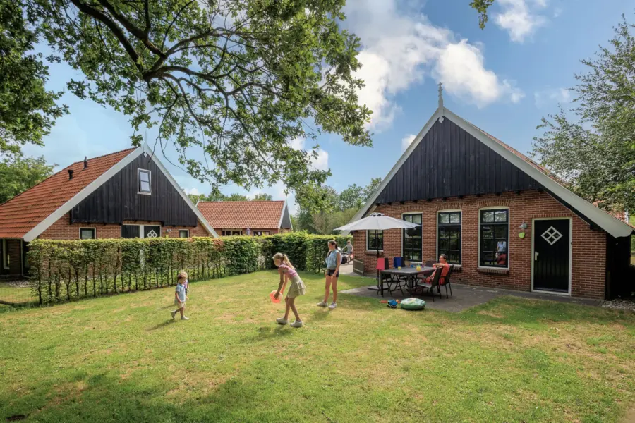 Terras kinderbungalow Boerderij Kaps