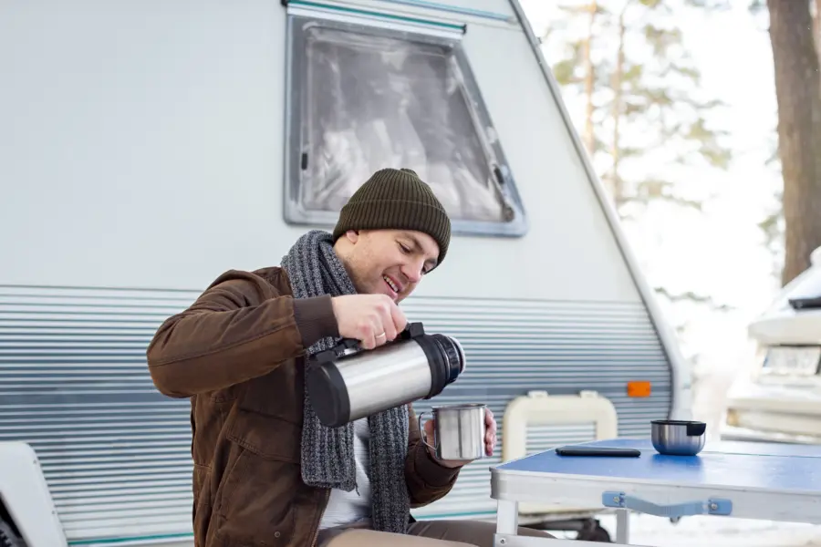 Medium shot man pouring coffee